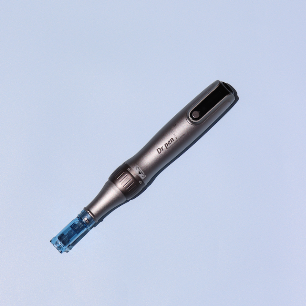 One metallic gray microneedling pen with blue needle cartridge and 'Dr. pen' text on light blue background.