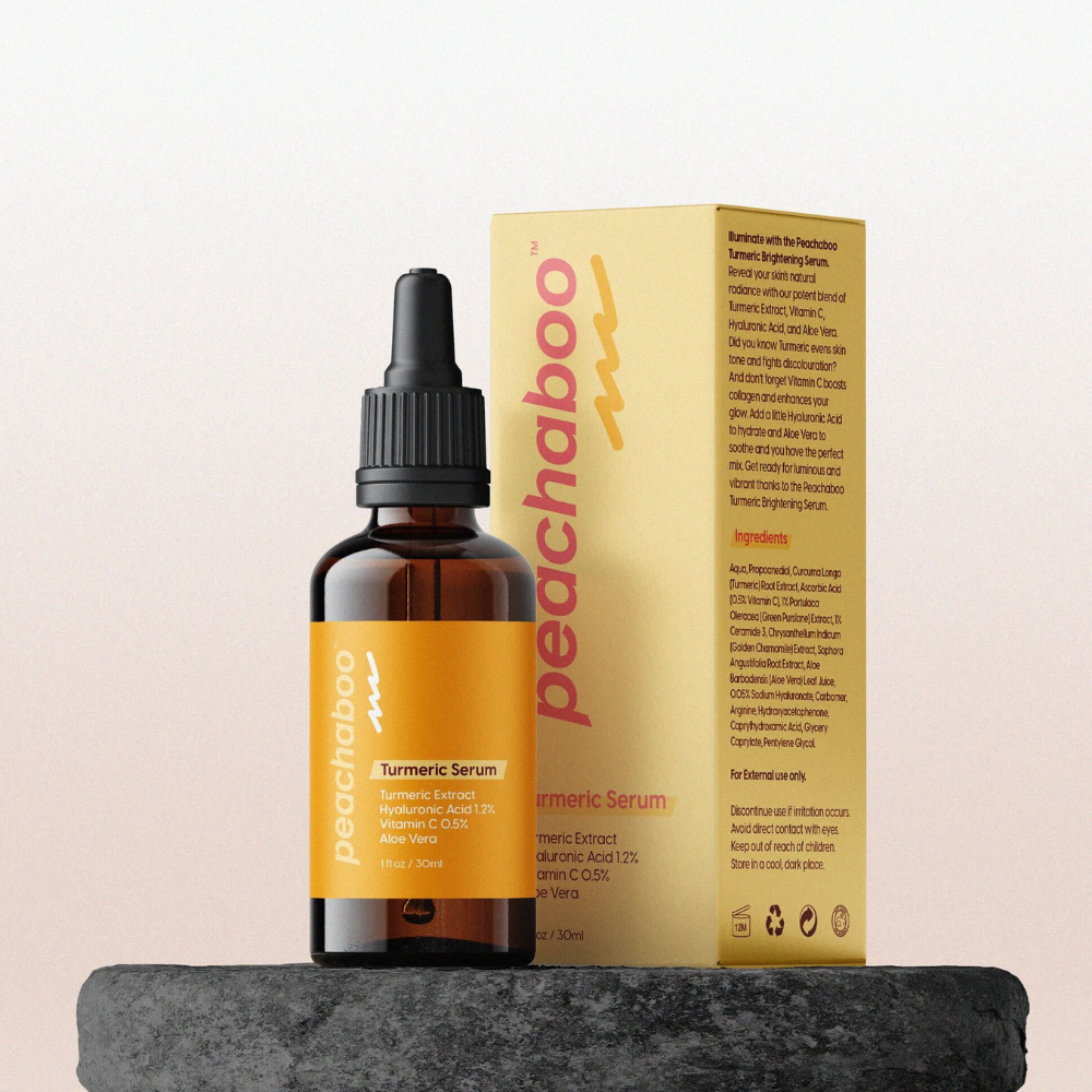 A vibrant bottle of Peachaboo Turmeric Brightening Serum, showcasing its bright packaging and appealing design.