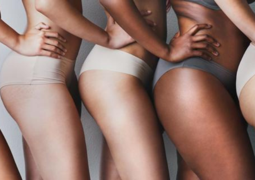 Group of women displaying their stretch marks 