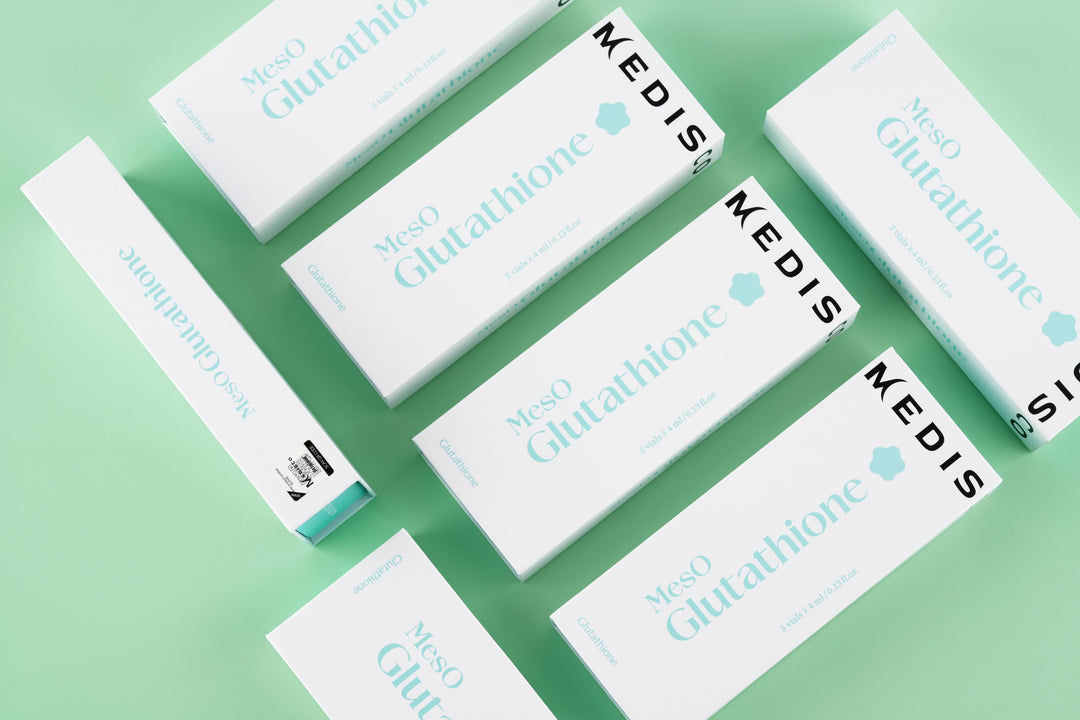 Flatlay of Medisco MesO Glutathione Ampoule packaging arranged on a mint green background.