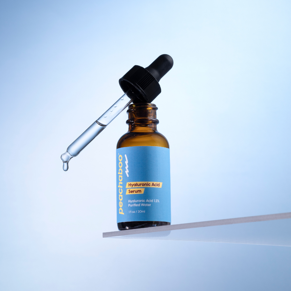 Brown glass bottle with dropper labeled 'Pachetoo' on a light blue background