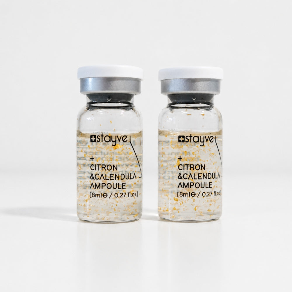 Two Stayve Citron and Calendula Ampoule vials with botanical particles for skin care