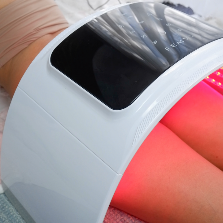 a woman using Peachaboo LED Light Therapy Pod