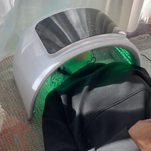  a woman using Femvy LED Light Therapy Pod